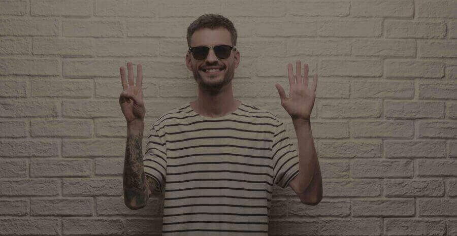 man-with-tatoo-and-eight-fingers