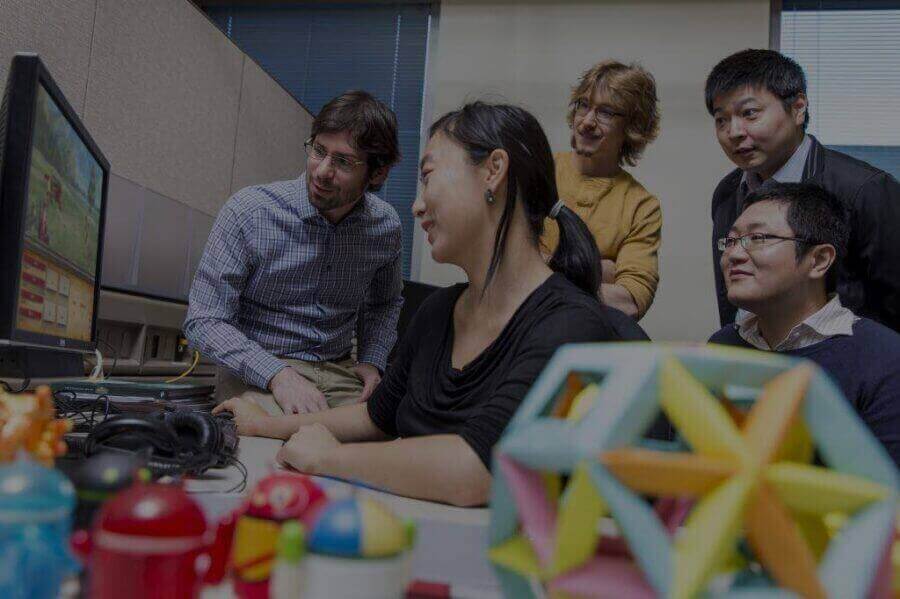 artificial-intelligence-team-in-front-of-computer